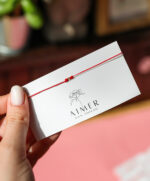 Bratara cu o biluta de aur 14k pe snur rosu si alb ( martisor)